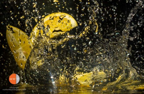 Image of a lemon splashing in water