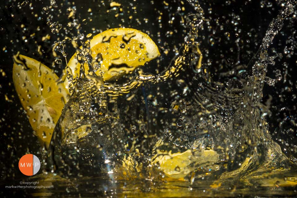 Image of a lemon splashing in water