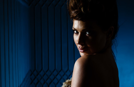 haed shot of model with blue background